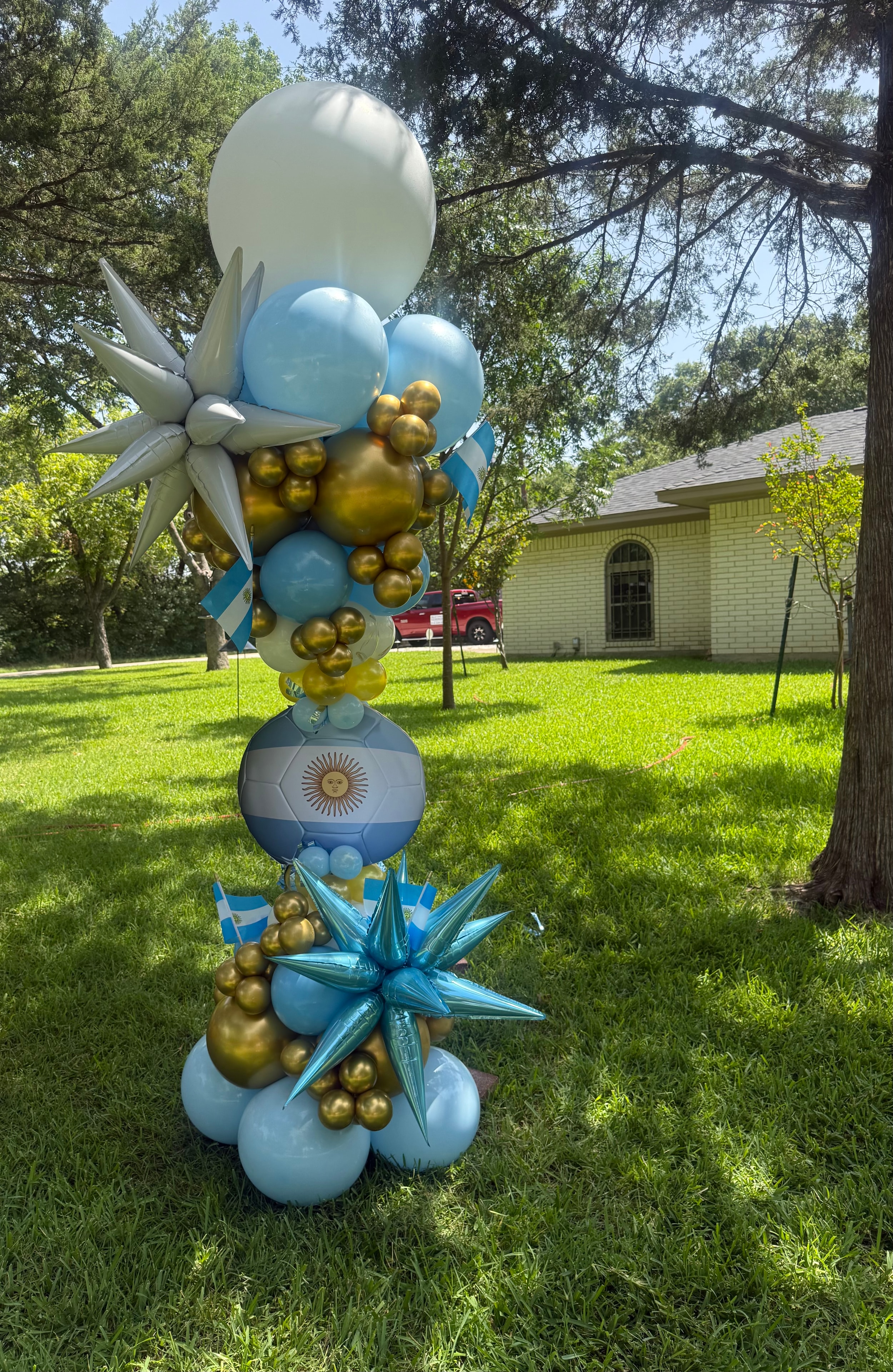 Argentina soccer tower sky blue gold white balloons