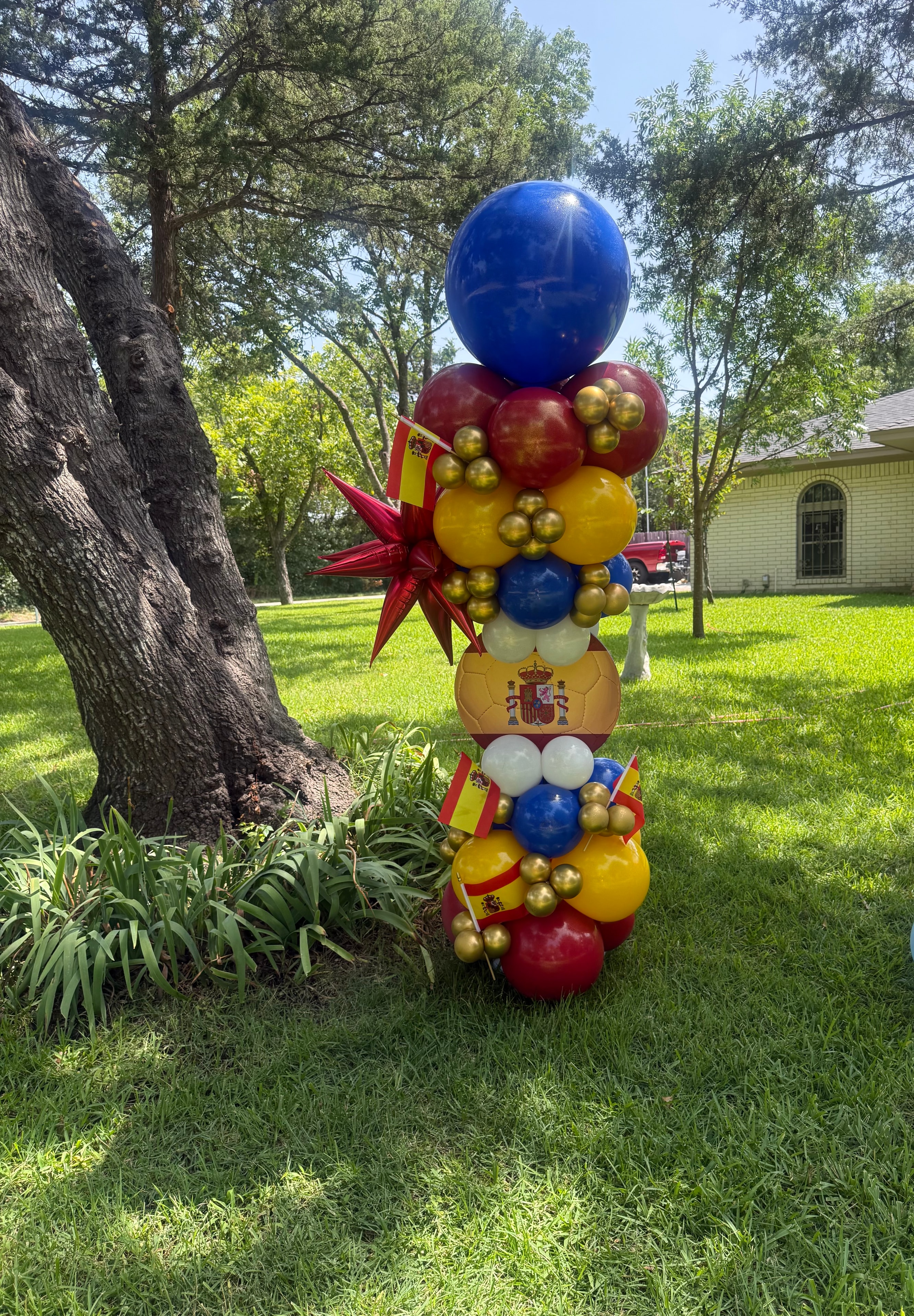 Spain soccer tower red gold blue white balloons